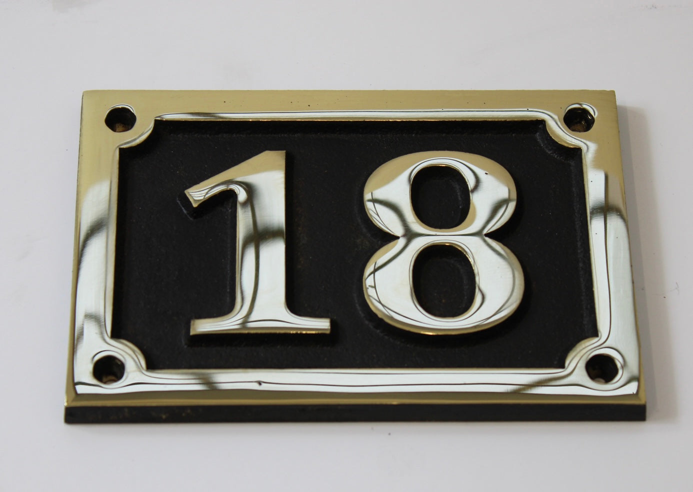 house number sign in bronze