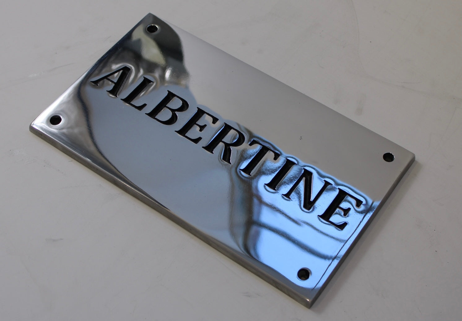Polished aluminium name sign