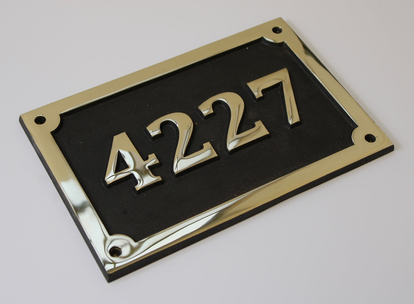 house number sign in bronze
