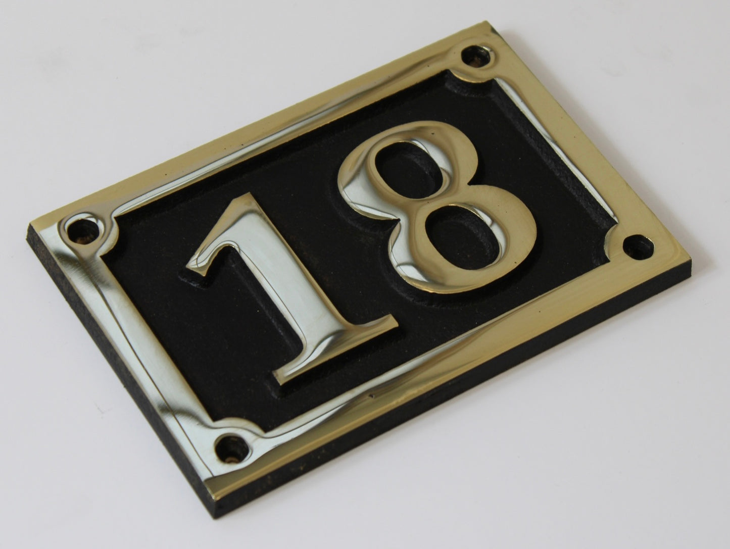 house number sign in bronze