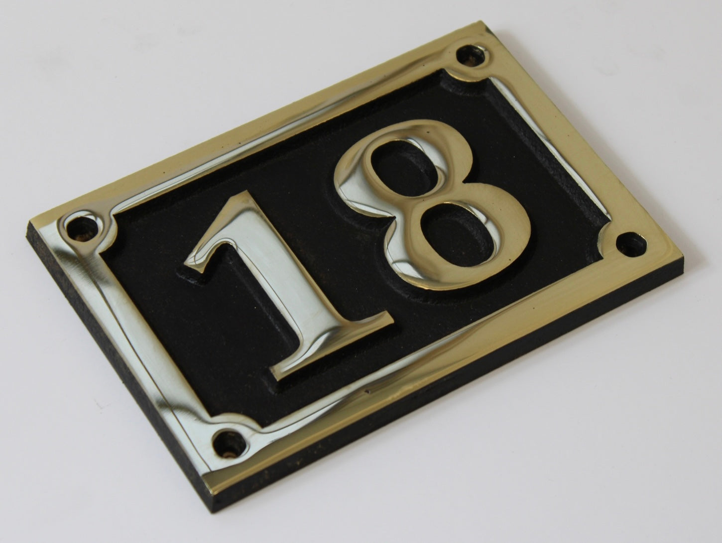 house number sign in bronze