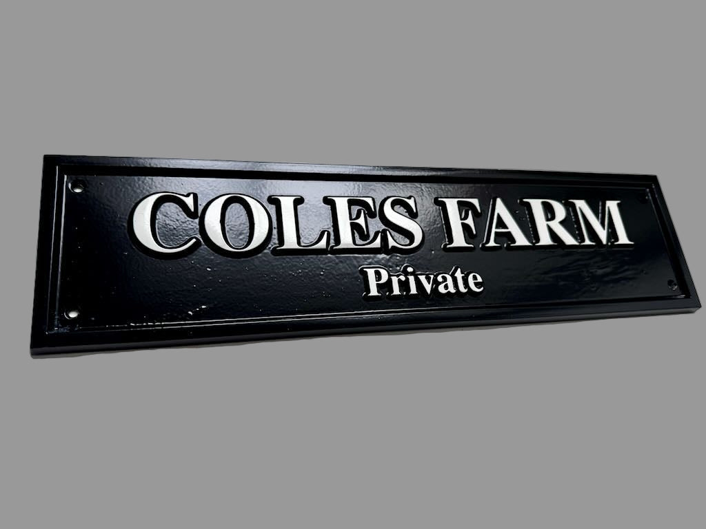 Black and white cast plaque