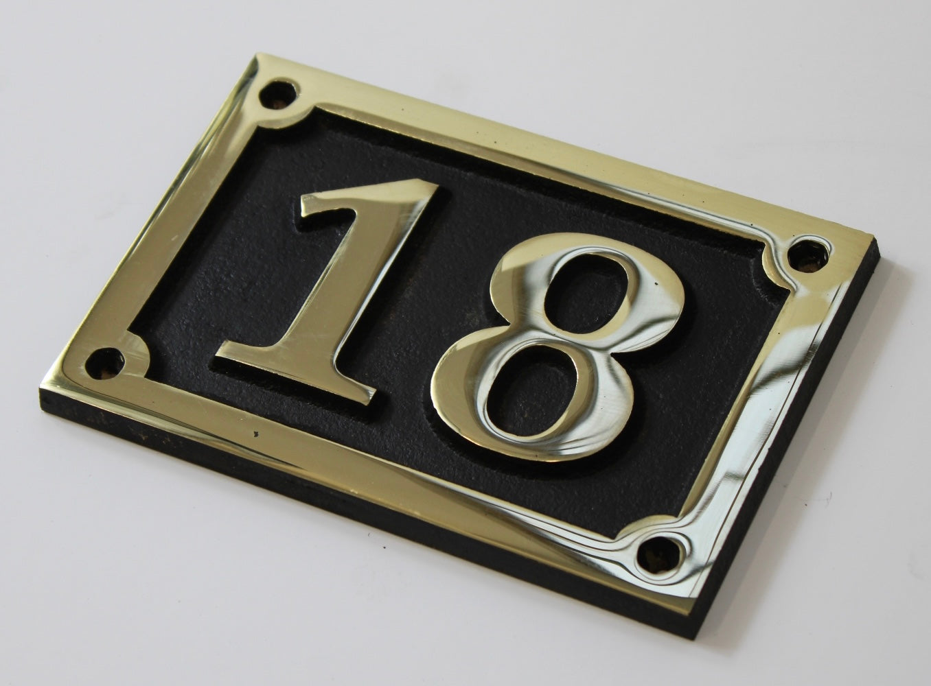 house number sign in bronze
