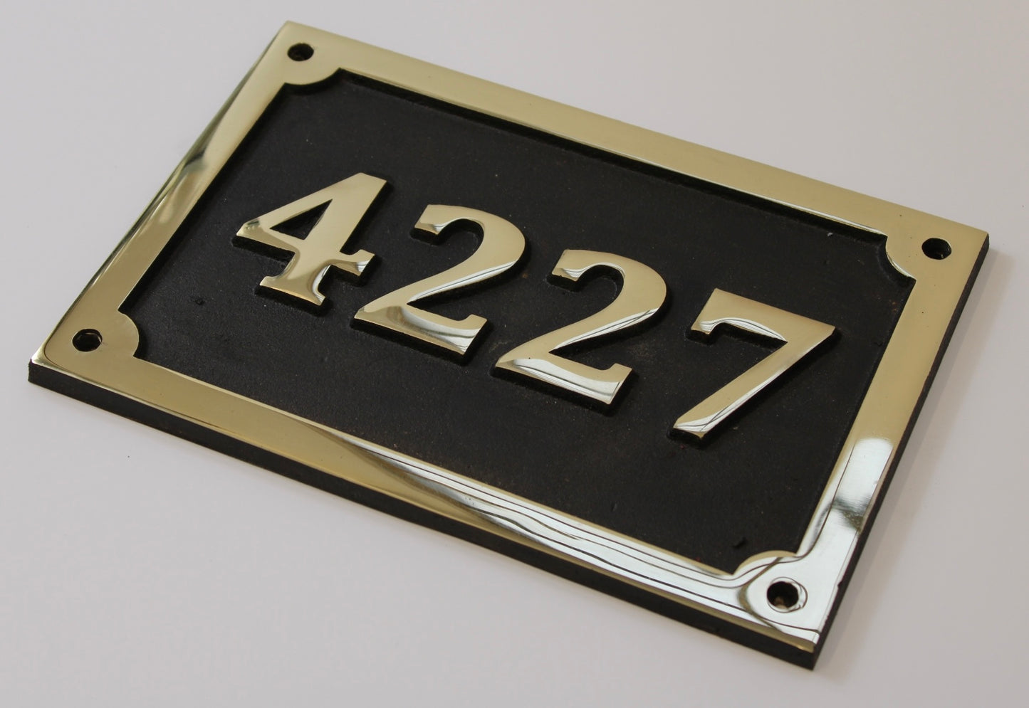 house number sign in bronze