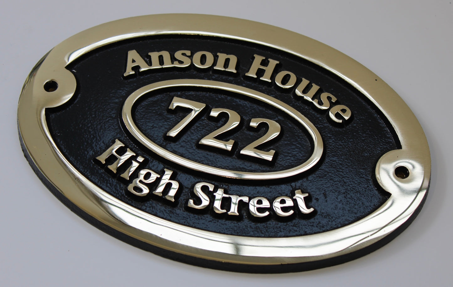 Bronze address sign black background