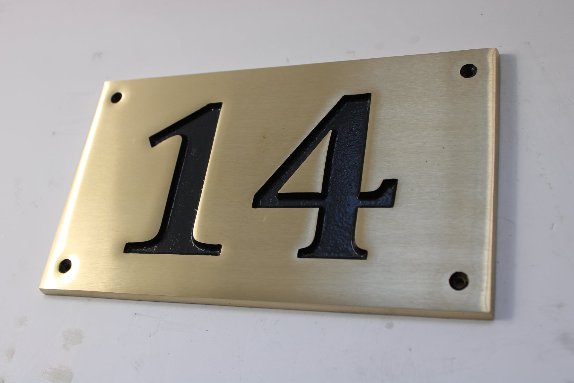 Brushed bronze number plate