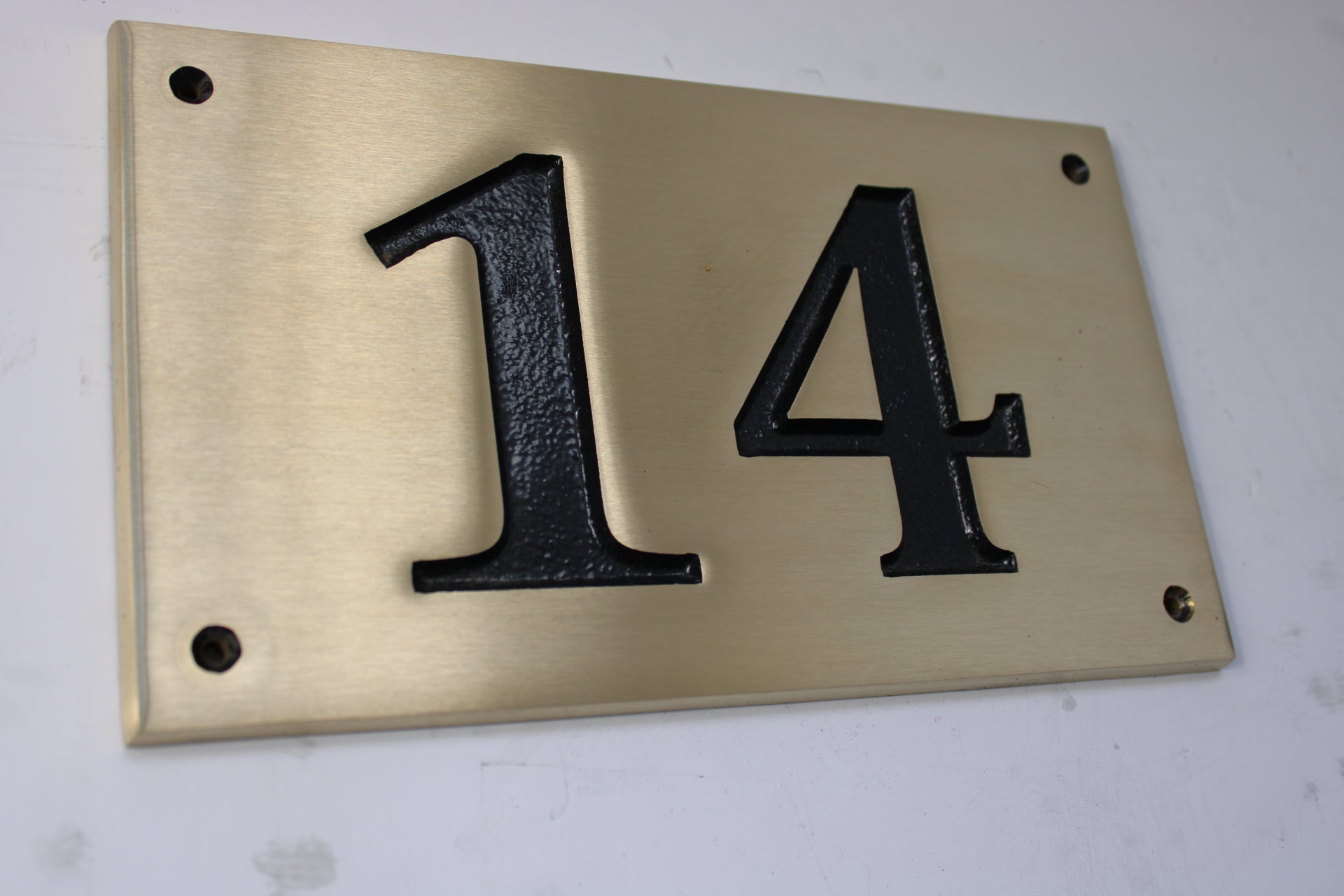 Brushed bronze number plate