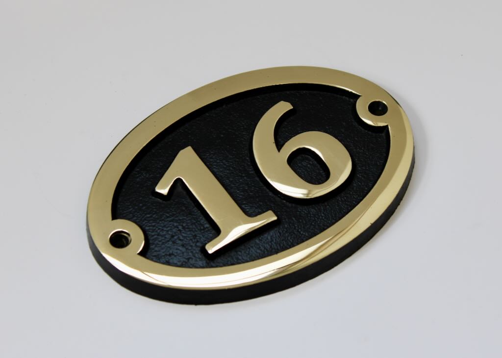 house number sign in bronze oval shape
