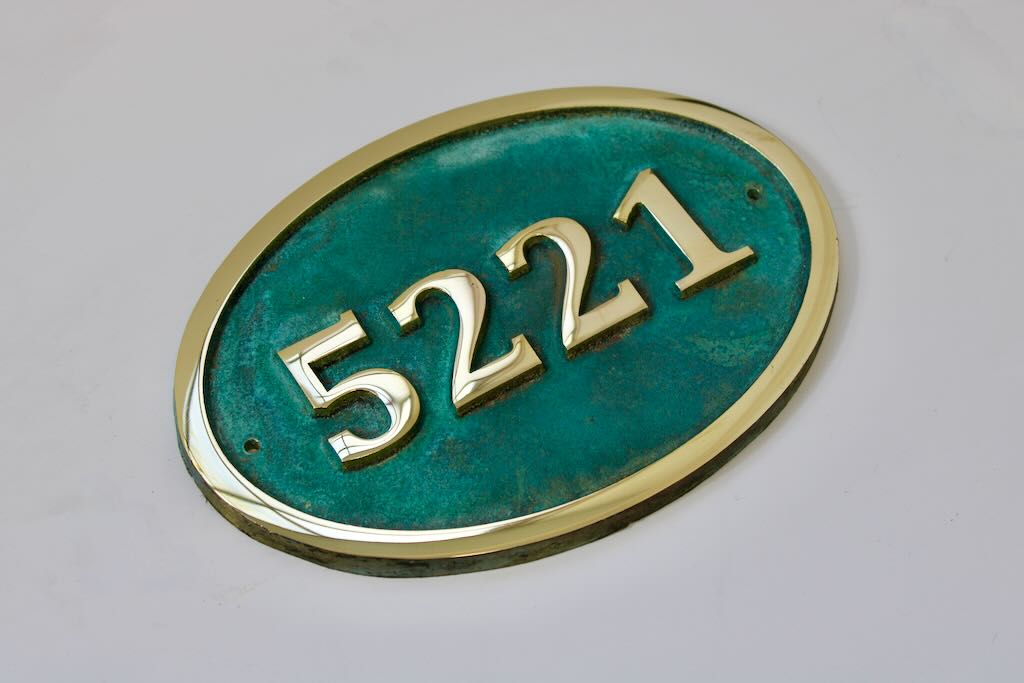 House number sign oval in bronze with Verdigris background