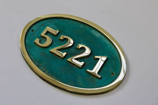 House number sign oval in bronze with Verdigris background