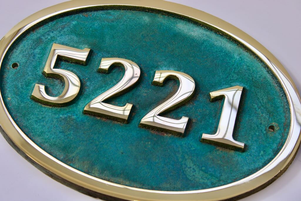 House number sign oval in bronze with Verdigris background