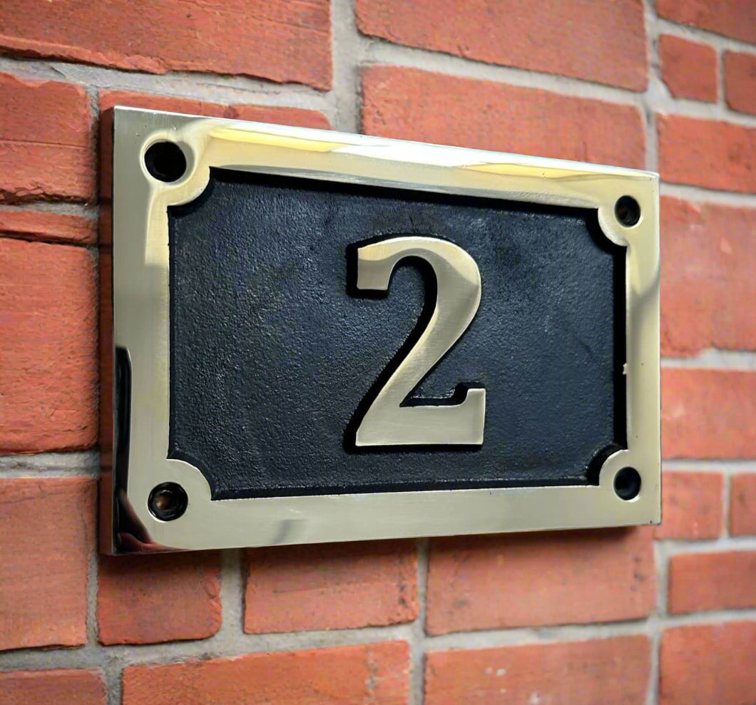 house number sign in bronze