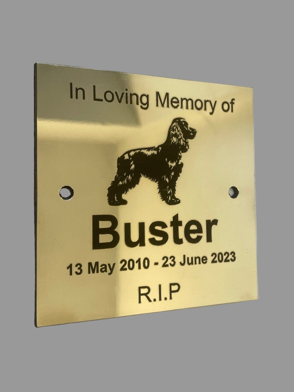 Memorial plaque for a dog named Buster on a gray background