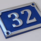 house number sign in aluminium with blue background