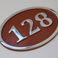 house number sign oval in copper