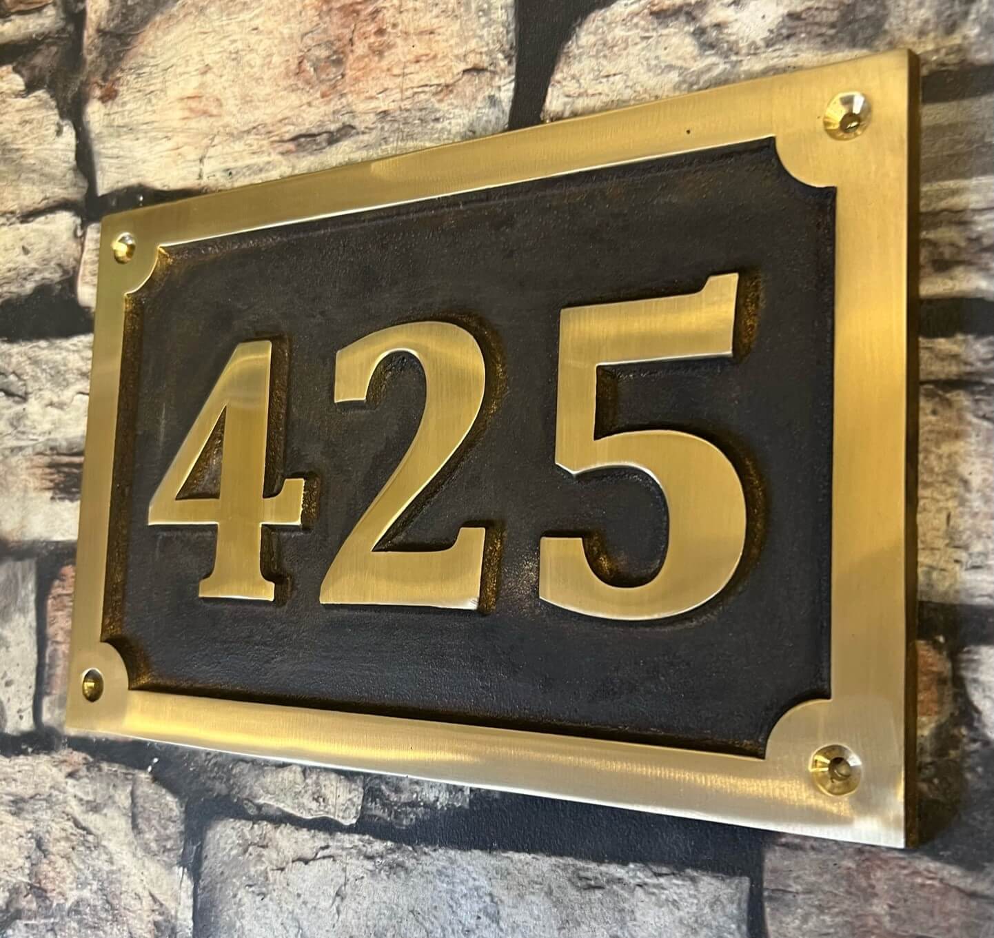 Cast House Sign in Bronze with patina background
