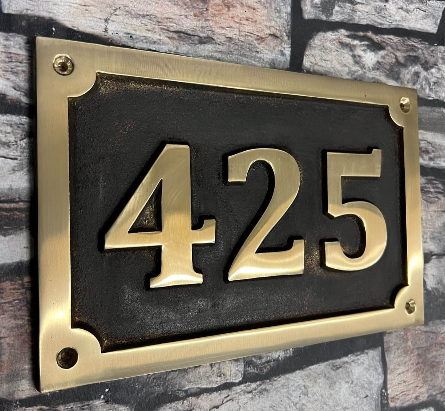 Cast House Sign in Bronze with patina background