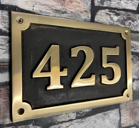 Cast House Sign in Bronze with patina background