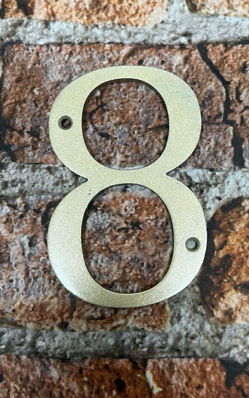 Door numbers in gold