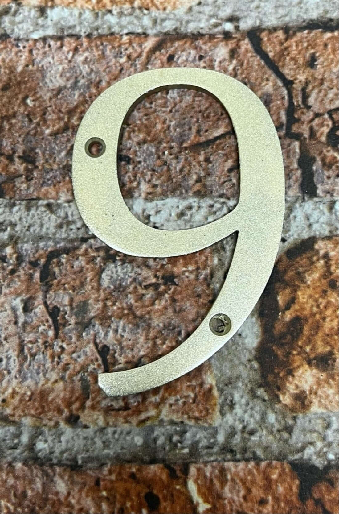 Door numbers in gold