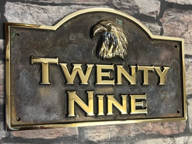 House plaque with curved top rainbow patina