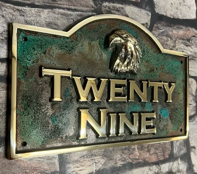 House plaque with curved top verdigris