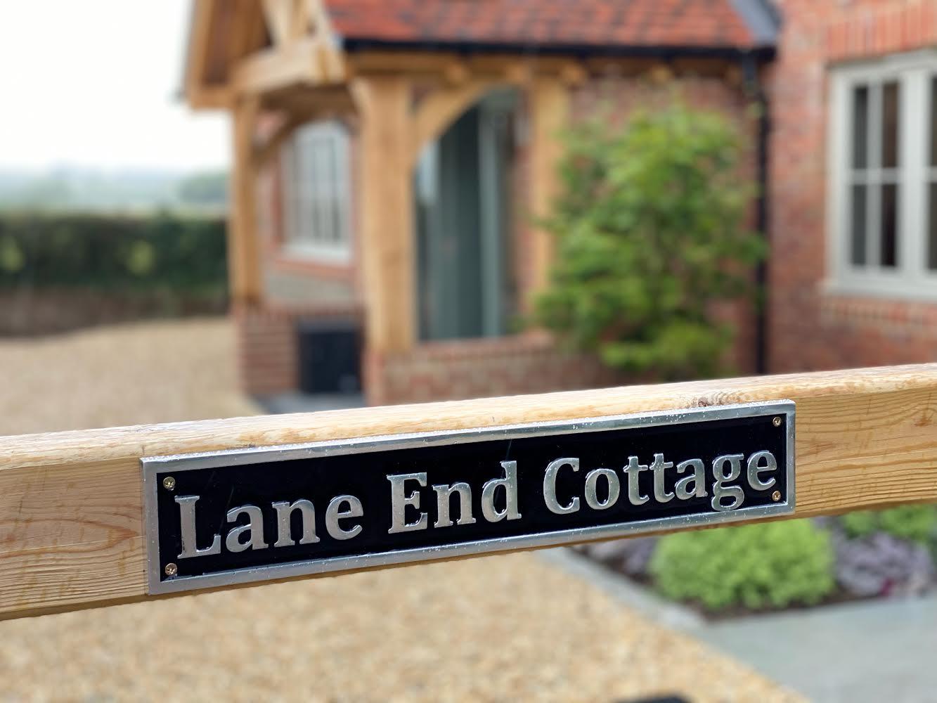 house name sign fixed to a gate
