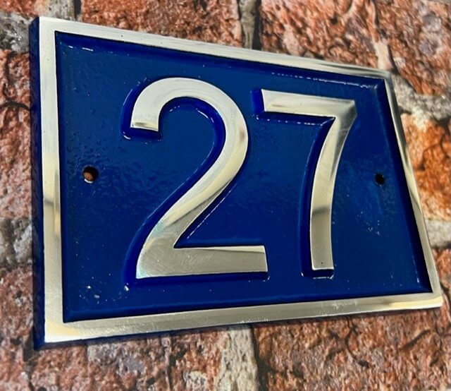 Modern door number sign in blue