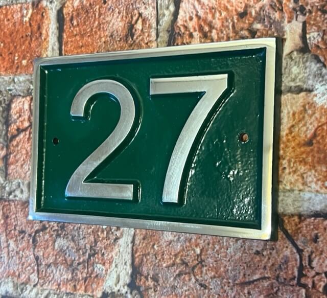 Modern door number sign in green