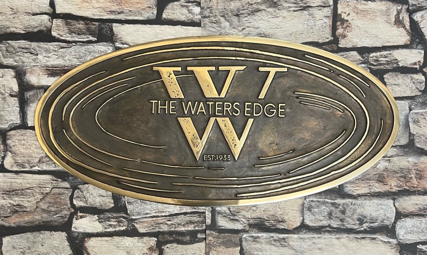 cast sign in bronze