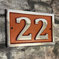house number sign with copper background