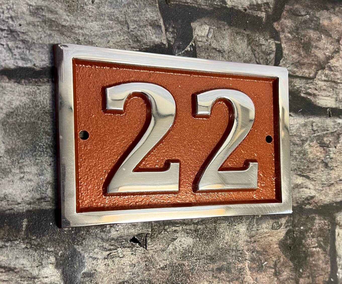 house number sign with copper background