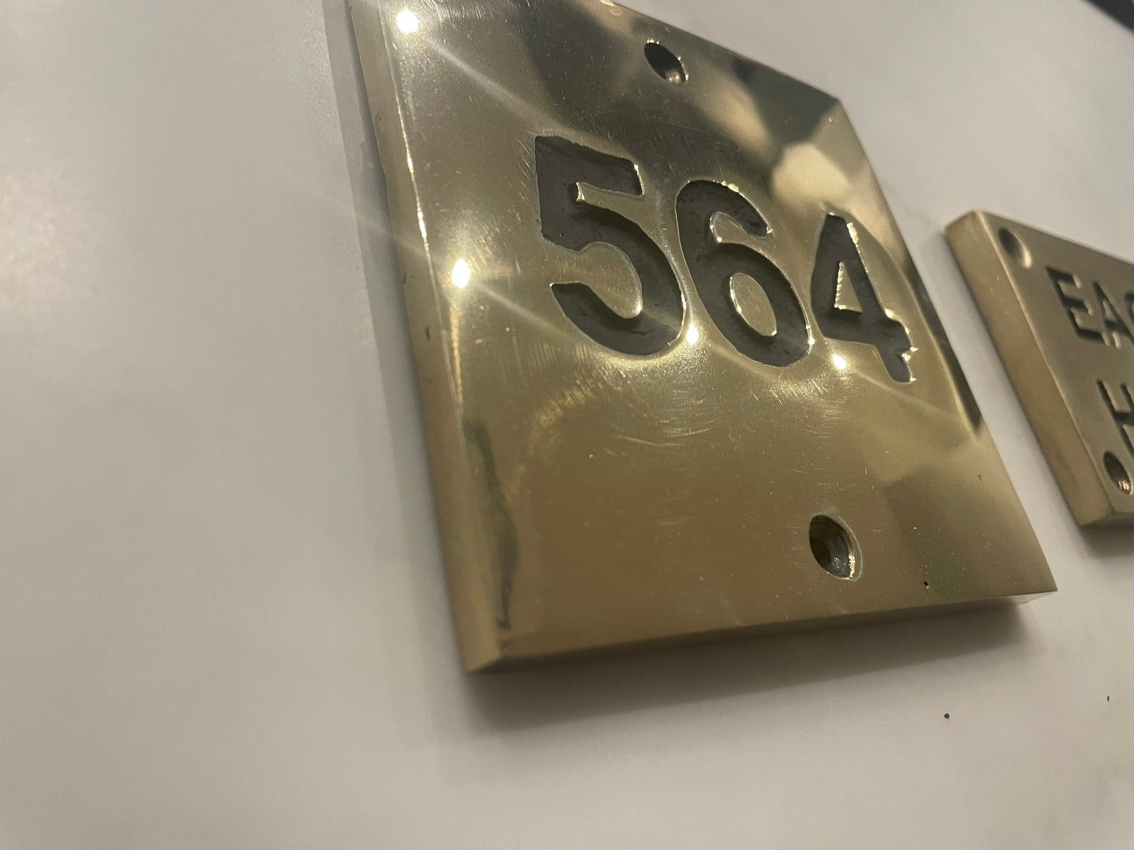 house number sign in bronze polished finish