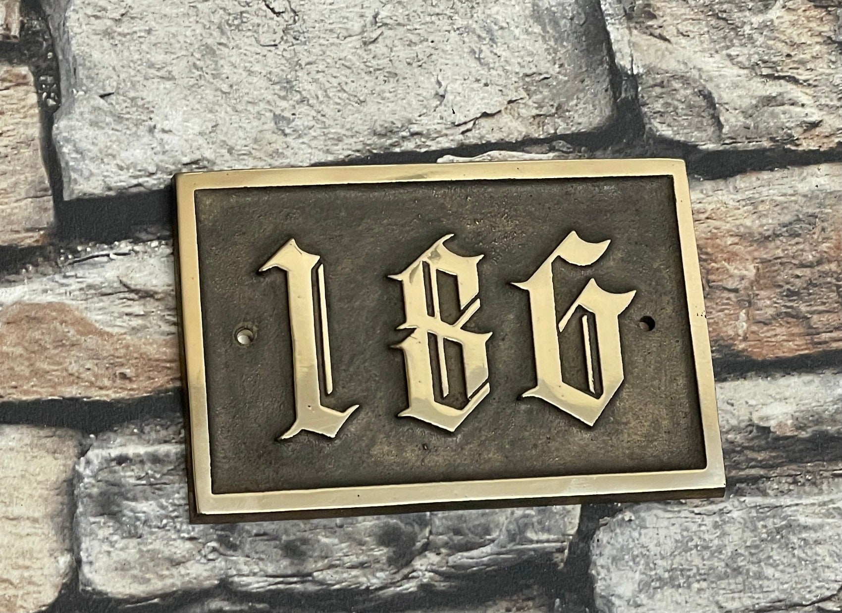 Traditional house sign old English font