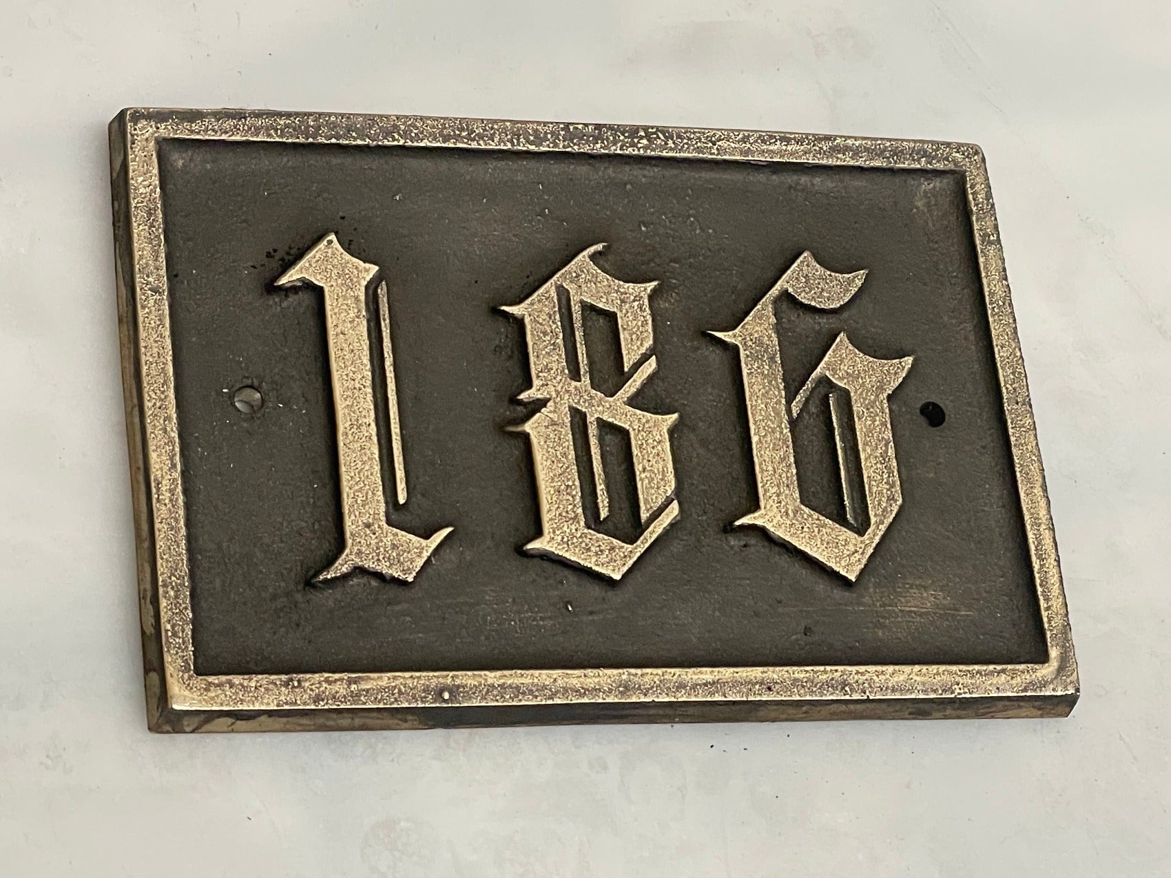 Traditional house sign old English font