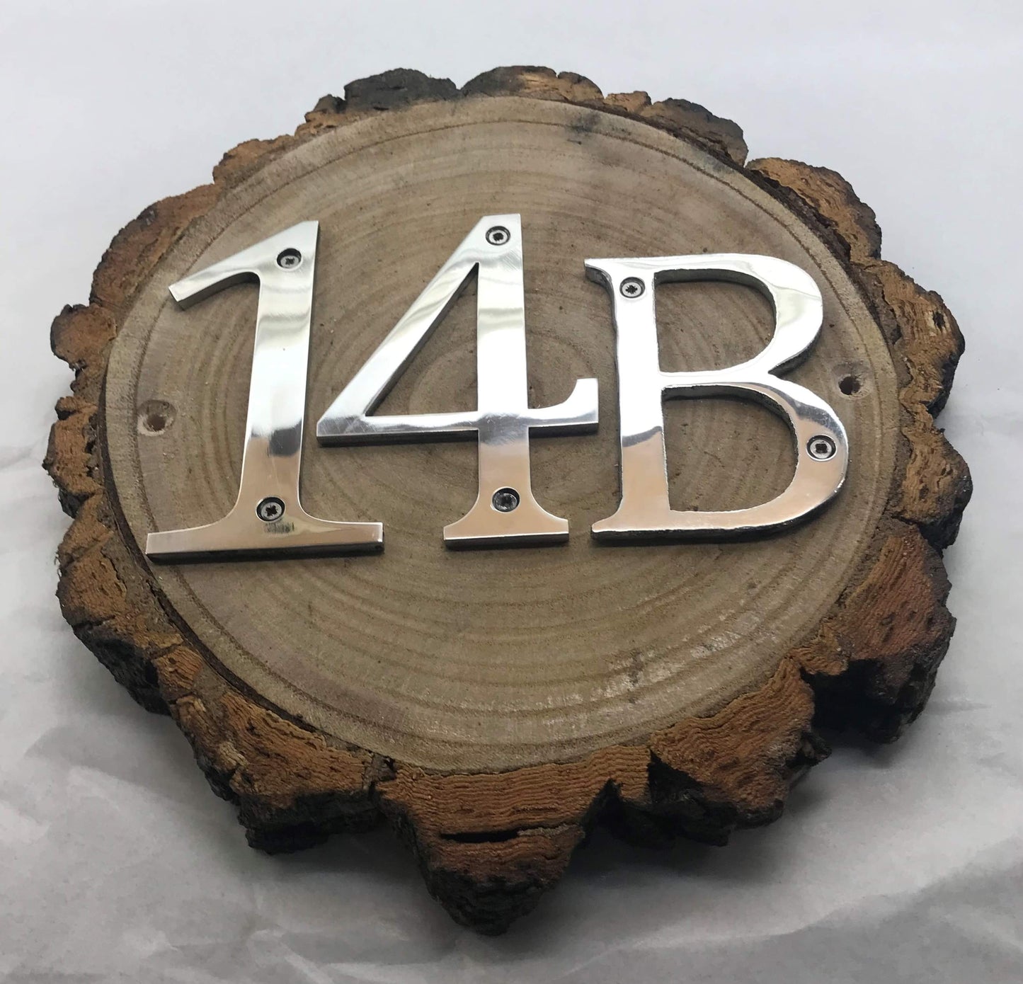 Metal House Numbers on Wood Log