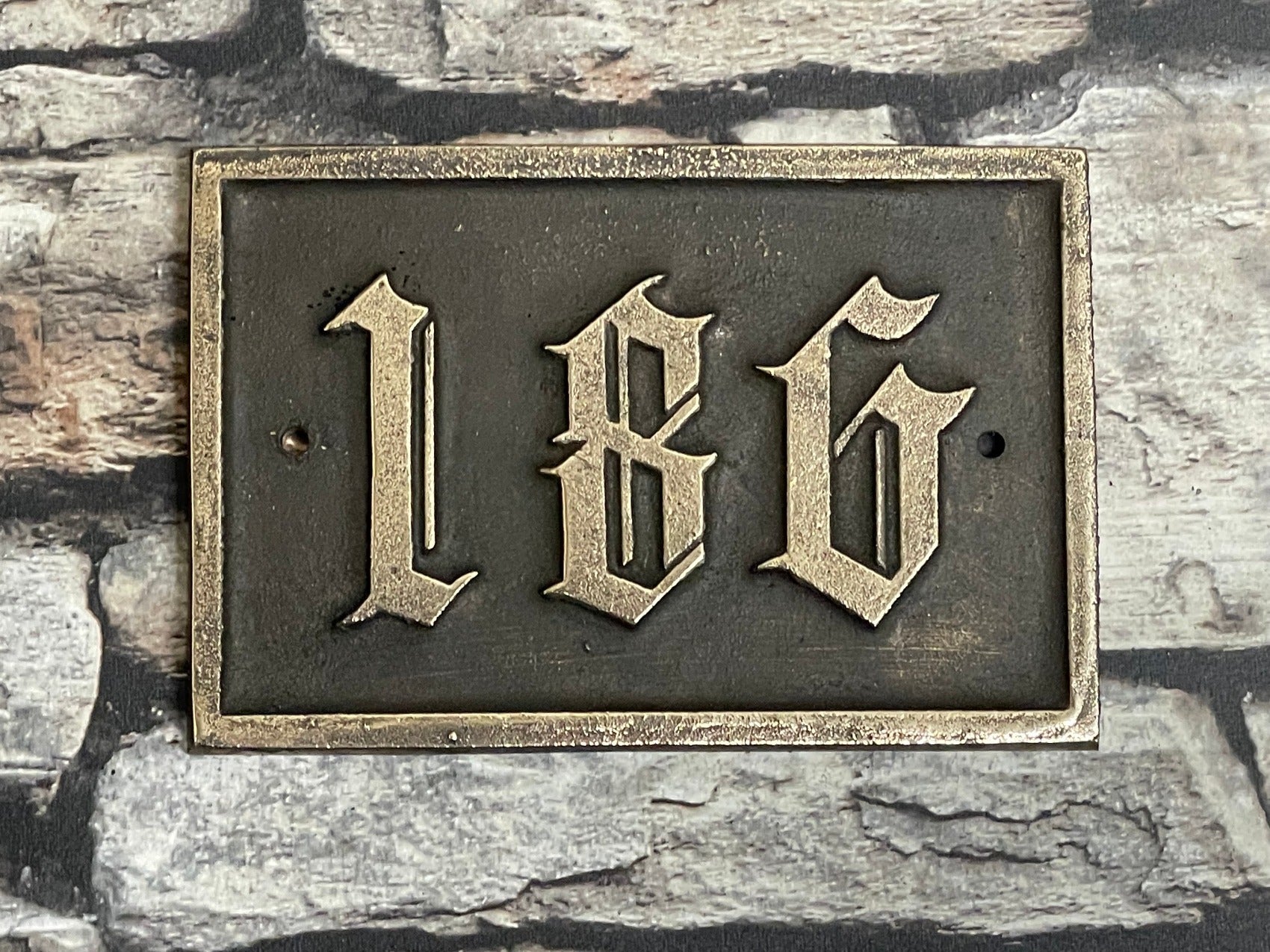 Traditional house sign old English font