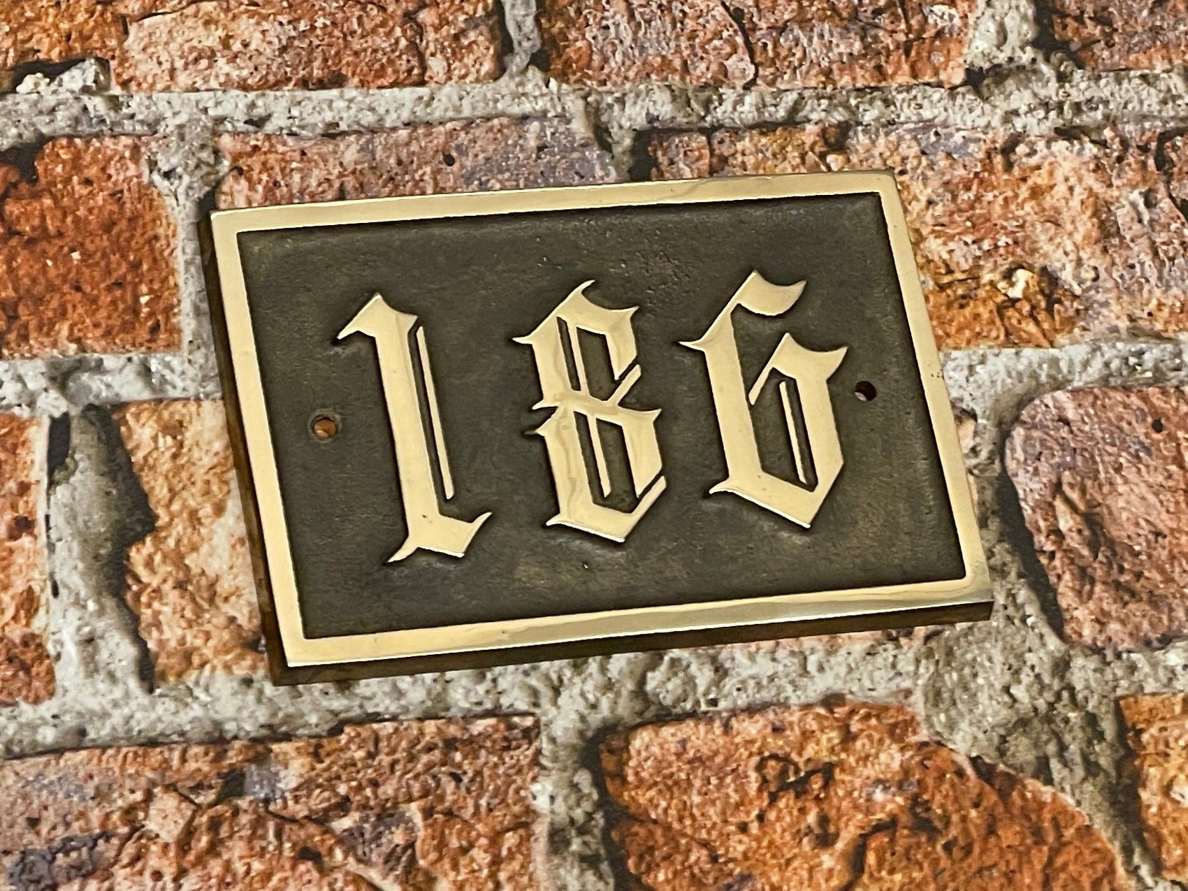 Traditional house sign old English font