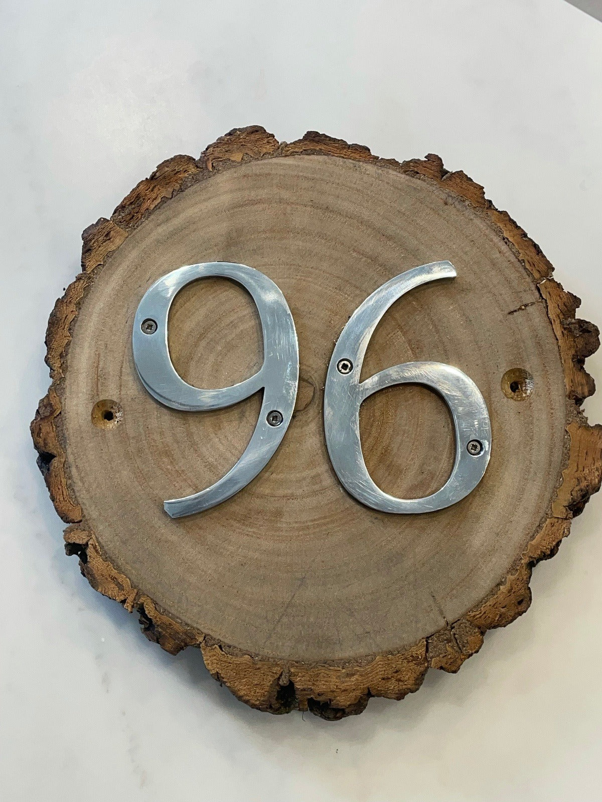 Metal House Numbers on Wood Log