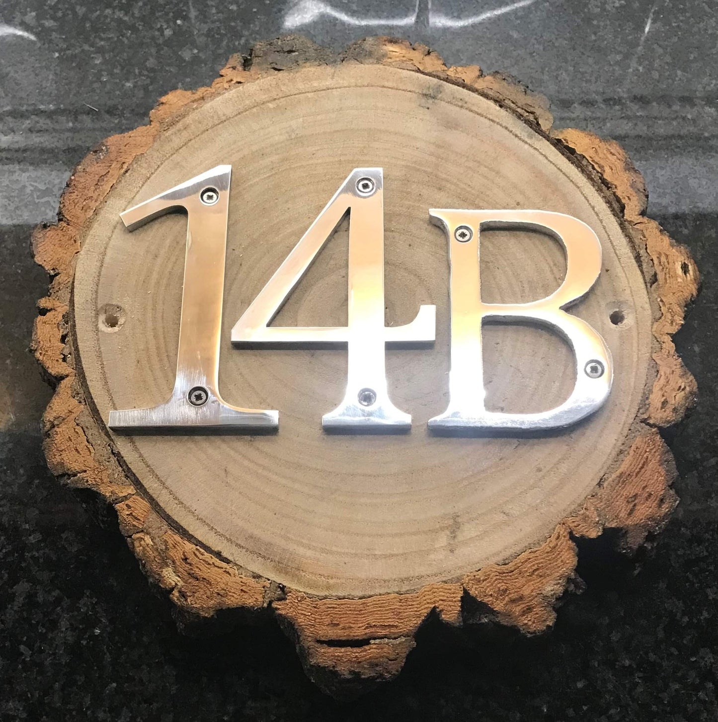 Metal House Numbers on Wood Log