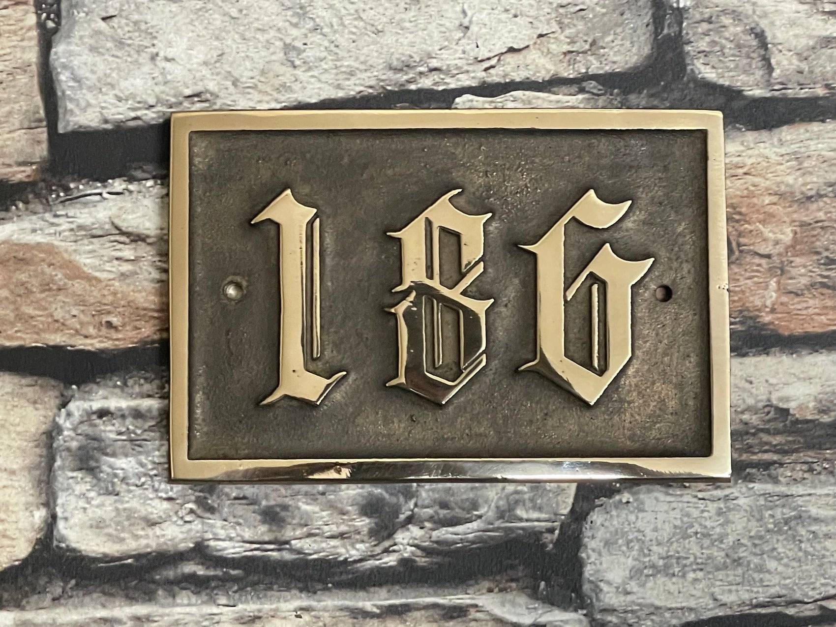 Traditional house sign old English font