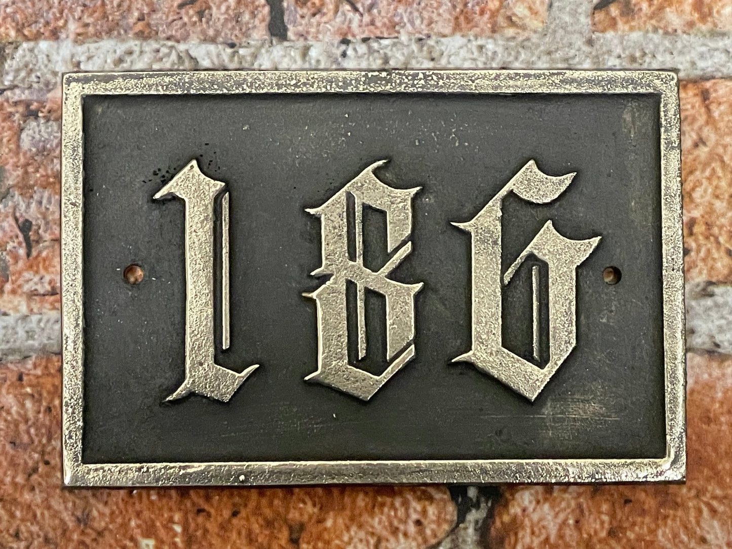 Traditional house sign old English font