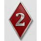 A diamond-shaped house number 2 wall plaque with a textured red background and a polished silver metal frame and numeral, mounted on a light gray textured wall.