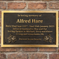 Cast bronze rectangle memorial plaque with satin finish, raised lettering and floral detail