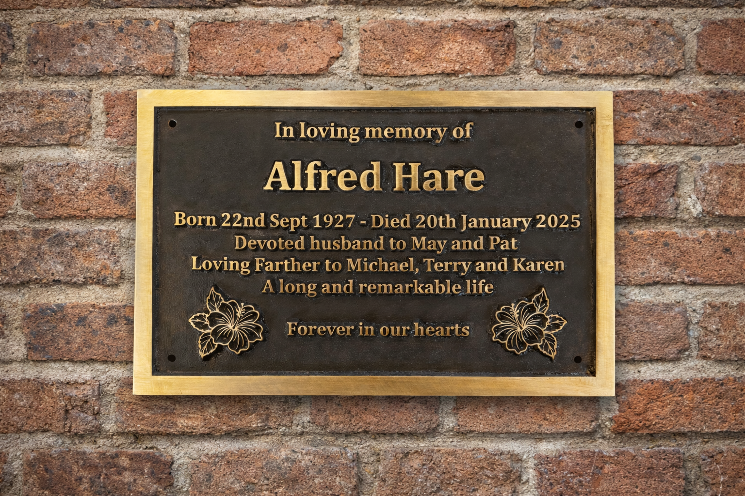 Cast bronze rectangle memorial plaque with satin finish, raised lettering and floral detail