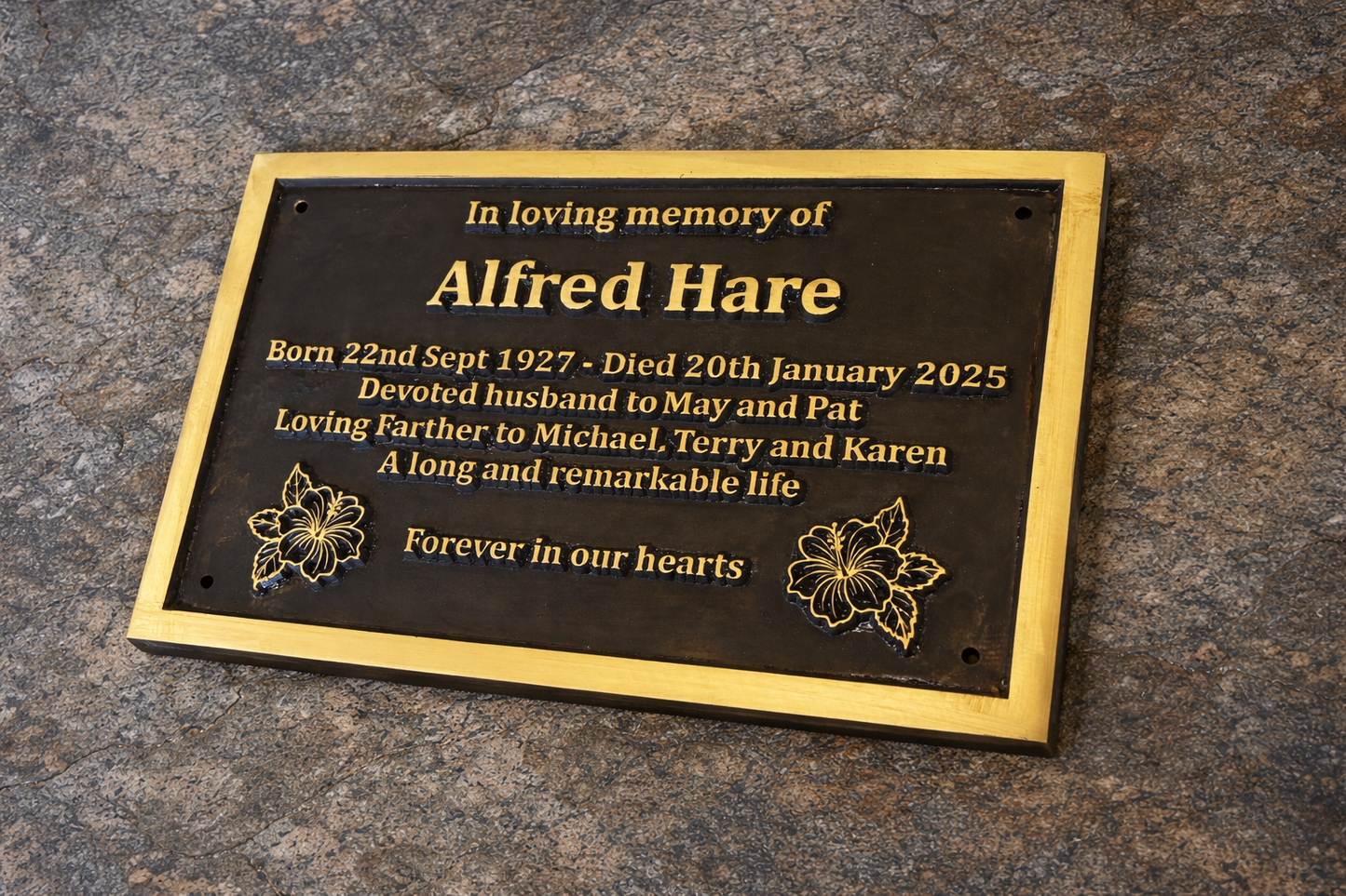 Cast bronze rectangle memorial plaque with satin finish, raised lettering and floral detail