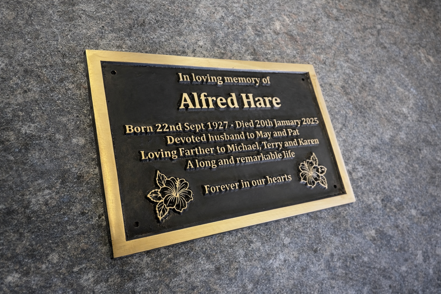 Cast bronze rectangle memorial plaque with satin finish, raised lettering and floral detail
