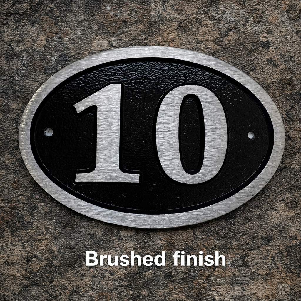 Cast aluminium oval, black background, brushed finish 