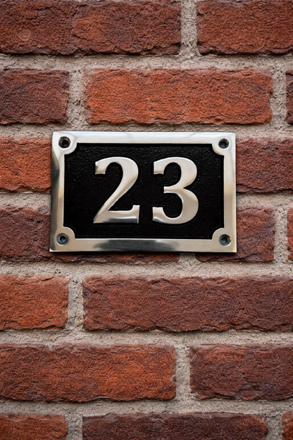 Cast aluminium rectangle house number sign with polished raised numbers and decorative border