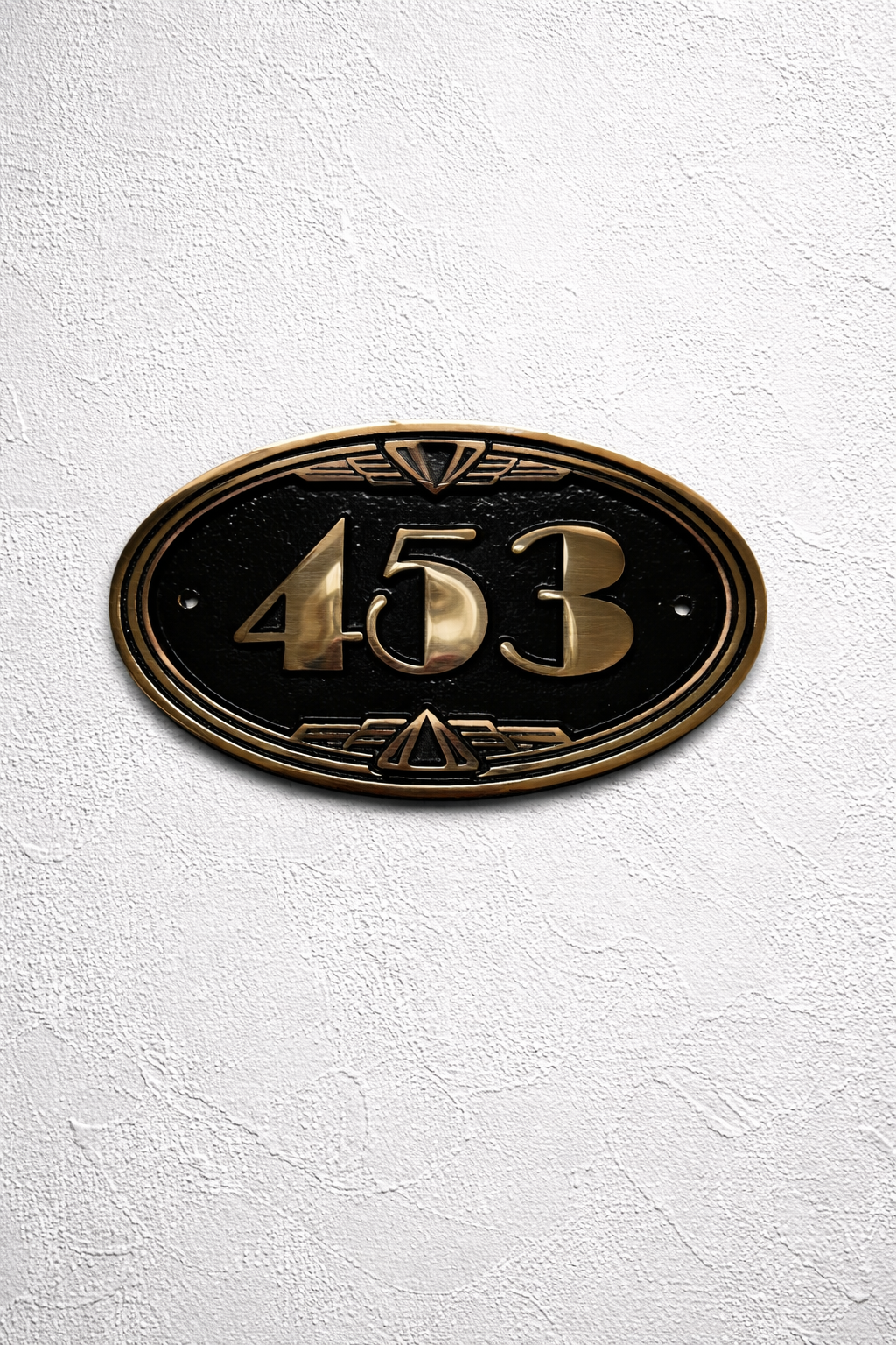 Art Deco bronze house number plaque oval with raised numbers mounted on wall